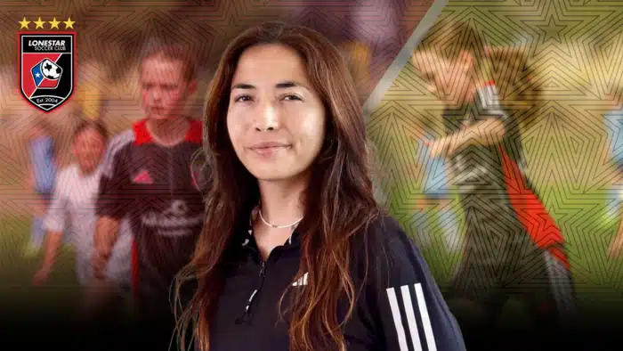 Soccer coach standing confidently in front of team backdrop with Lonestar Soccer Club logo.