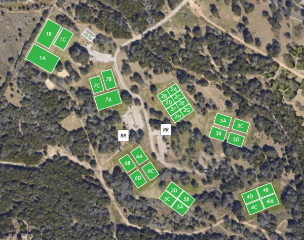 Aerial map of a campground with labeled sections amidst trees and pathways