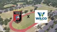 Aerial view of a track field with Lonestar Soccer Club and Wilco Texas logos displayed.